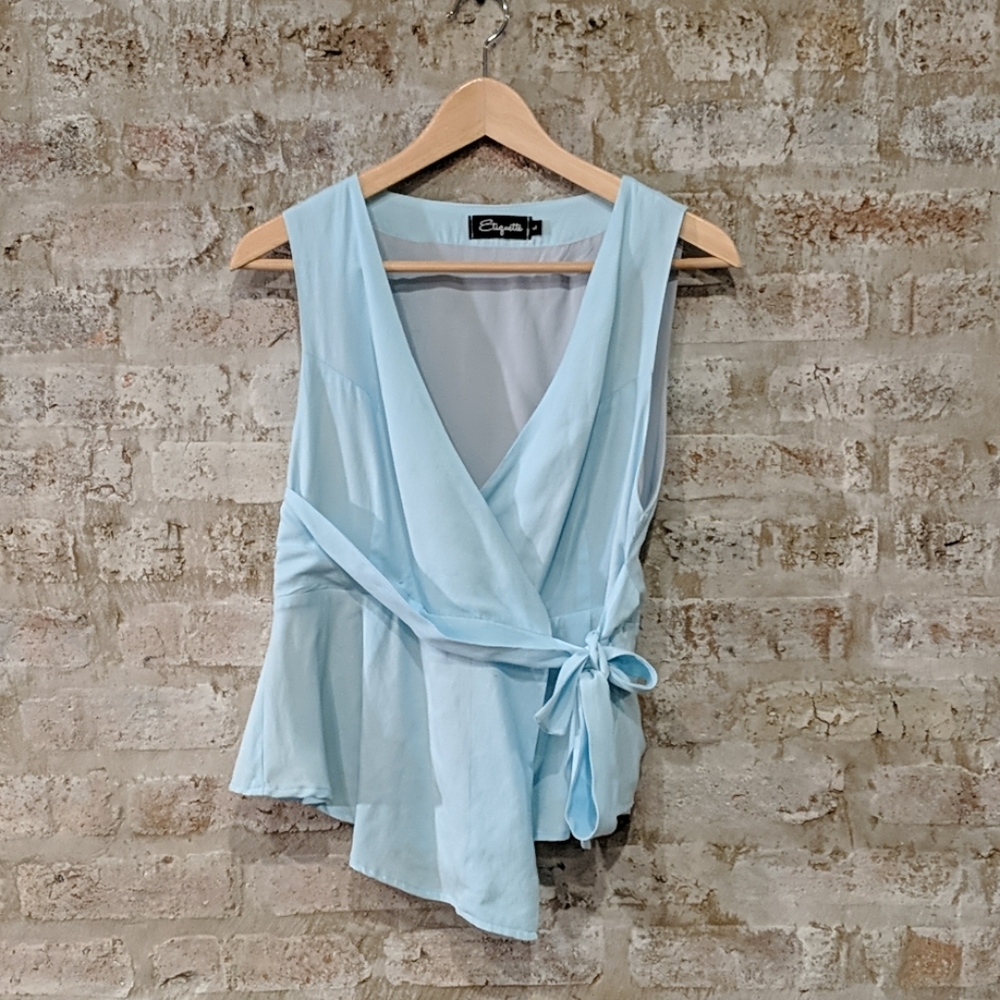 Light blue sleeveless blouse- Boutique